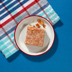 Top-down view of Bakewell Slice showing almond sponge and cherry jam layer - Cake Club.