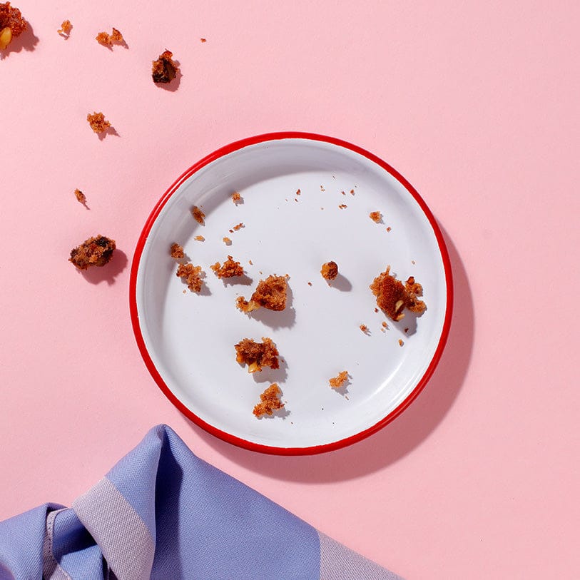 Empty plate with crumbs from Banana and Walnut Loaf.