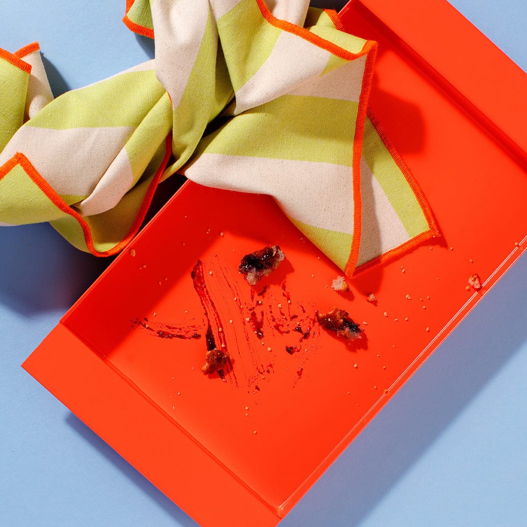 An overhead view of an empty box which used to contain six of our Blueberry Muffins.