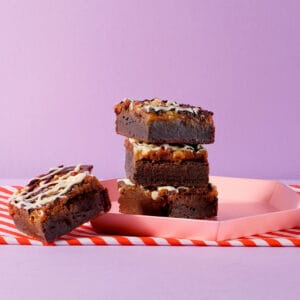 Four of our delicious Salted Caramel and Comb Brownies on a plate.